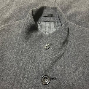 Vintage Mens black wool blend long overcoat featuring a minimalist button up design with stand collar made by A.A.R Durban Urban.Vintage coat ideal for fall and winter streetwear,office wear or layered casual looks.Classic and sleek,perfect for fashion forward individuals seeking timeless urban outerwear.This stylish trench style coat offers comfort,warmth and elegance for everyday city life or formal occasions.