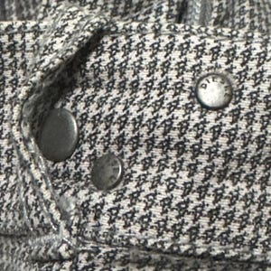 A vintage Diesel moto biker jacket with a checkered design featuring a full zip front, utility pockets and a streetwear aesthetic. Perfect for casual layering unisex fashion.