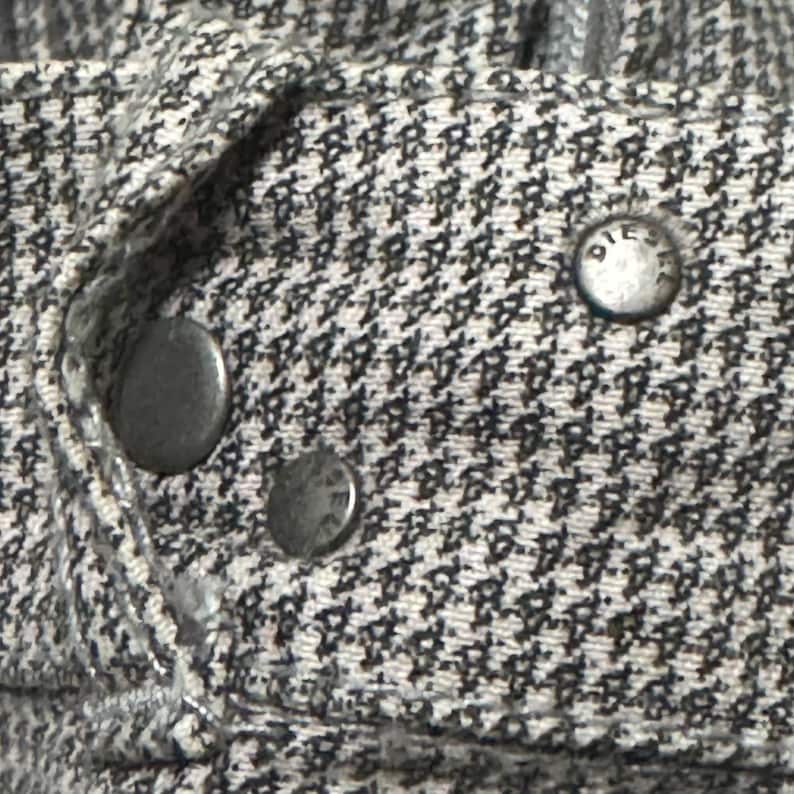 A vintage Diesel moto biker jacket with a checkered design featuring a full zip front, utility pockets and a streetwear aesthetic. Perfect for casual layering unisex fashion.