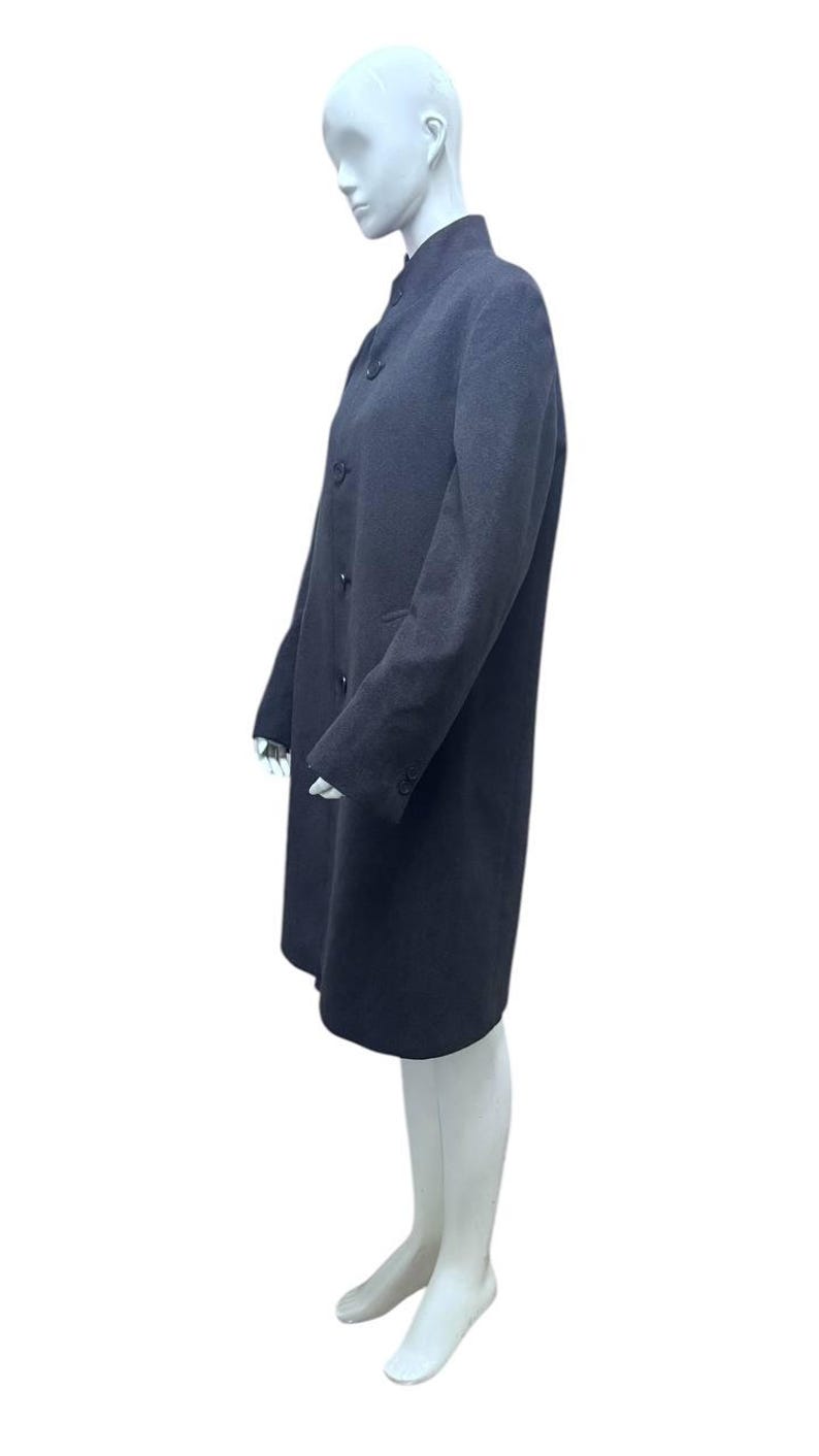 May include: A long-sleeved, dark gray coat with a mandarin collar and button closure. The coat is made of a soft, textured fabric.