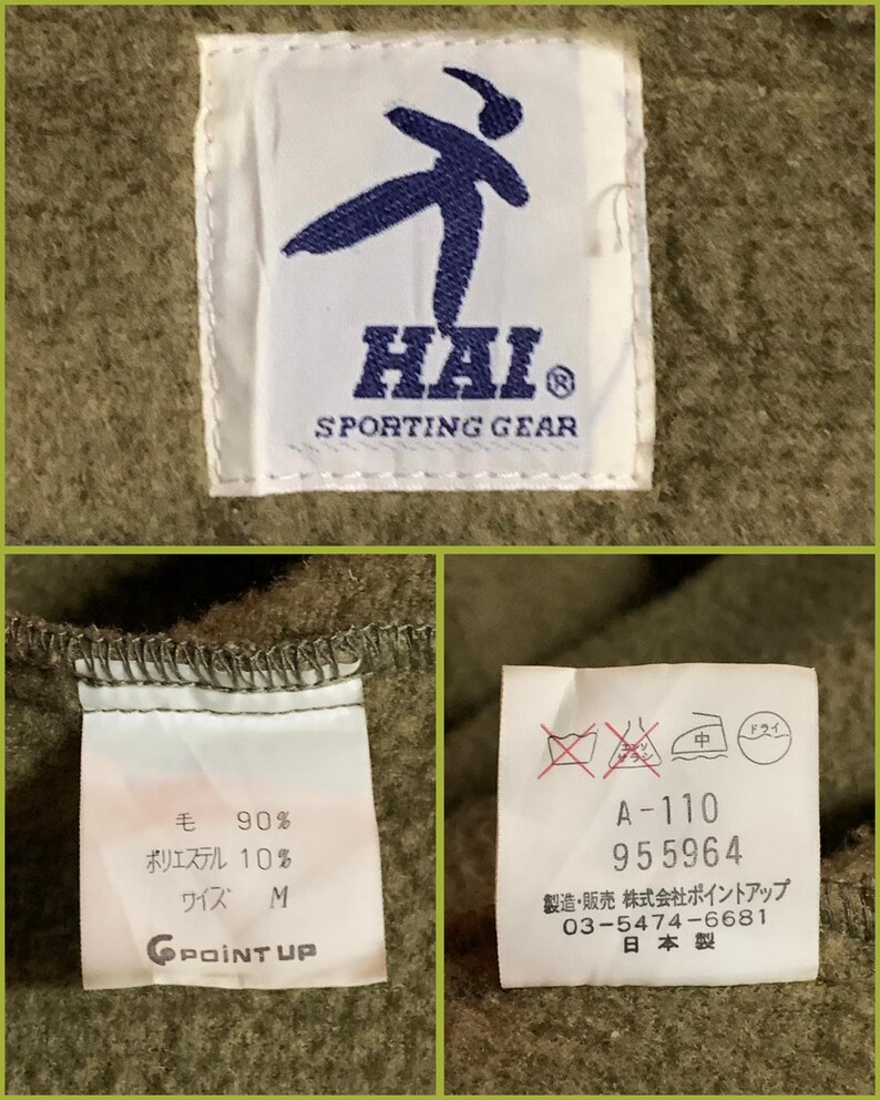 K&ouml;nnte beinhalten: Nahaufnahme eines gr&uuml;nen Stofflabels mit wei&szlig;em Text, der "HAI SPORTING GEAR" lautet. Das Etikett zeigt au&szlig;erdem eine blaue Silhouette einer Person, die einen Karate-Tritt ausf&uuml;hrt. Das Etikett ist an einem gr&uuml;nen Kleidungsst&uuml;ck befestigt.