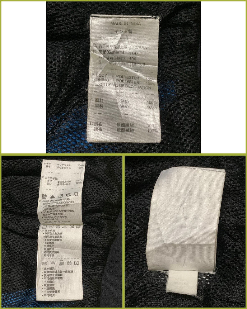 May include: A black and blue jacket with a white tag that says "Made in India" and includes size and fabric information in English and Japanese.