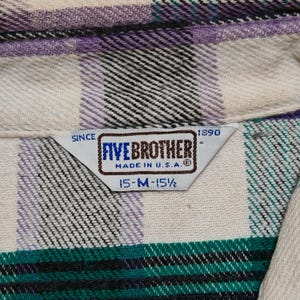 Vintage Five Brother flannel shirt made in USA with green black purple  and white plaid pattern, button down long sleeve cotton workwear top from the 1990s, classic outdoor style for men, grunge and streetwear fashion, warm fall winter shirt with dual chest pockets and durable construction, retro casual staple for collectors and flannel lovers.