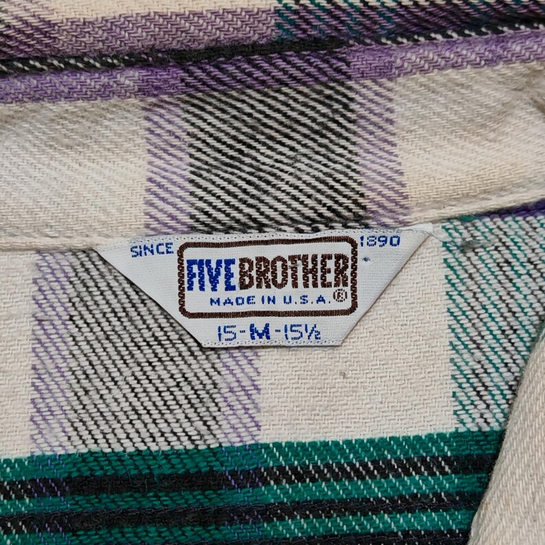 Vintage Five Brother flannel shirt made in USA with green black purple  and white plaid pattern, button down long sleeve cotton workwear top from the 1990s, classic outdoor style for men, grunge and streetwear fashion, warm fall winter shirt with dual chest pockets and durable construction, retro casual staple for collectors and flannel lovers.