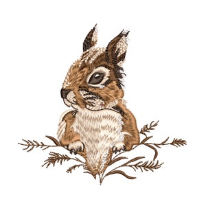May include: Embroidered illustration of a brown squirrel sitting in a bush with green leaves. The squirrel is looking to the left and has a white belly.