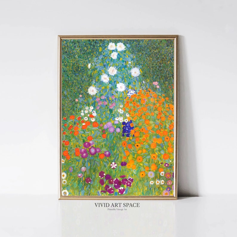 May include: A framed print of a colorful garden scene. The artwork features a vibrant array of flowers in shades of orange, purple, white, and blue, set against a green background. The frame is gold, and the text "VIVID ART SPACE" is visible at the bottom.