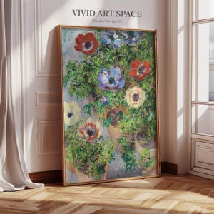 May include: A framed floral print featuring a vibrant bouquet of red, blue, and white anemone flowers. The artwork has a gold frame and the text "VIVID ART SPACE Printable Vintage Art" at the top.