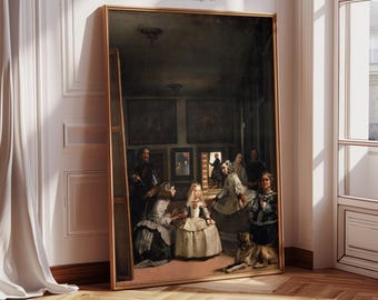 May include: A framed vintage print of a historical painting, leaning against a wall. The artwork depicts a group of people in a room, with a dog in the foreground. The frame is gold-toned, and the print has the text "VIVID ART SPACE Printable Vintage Art".