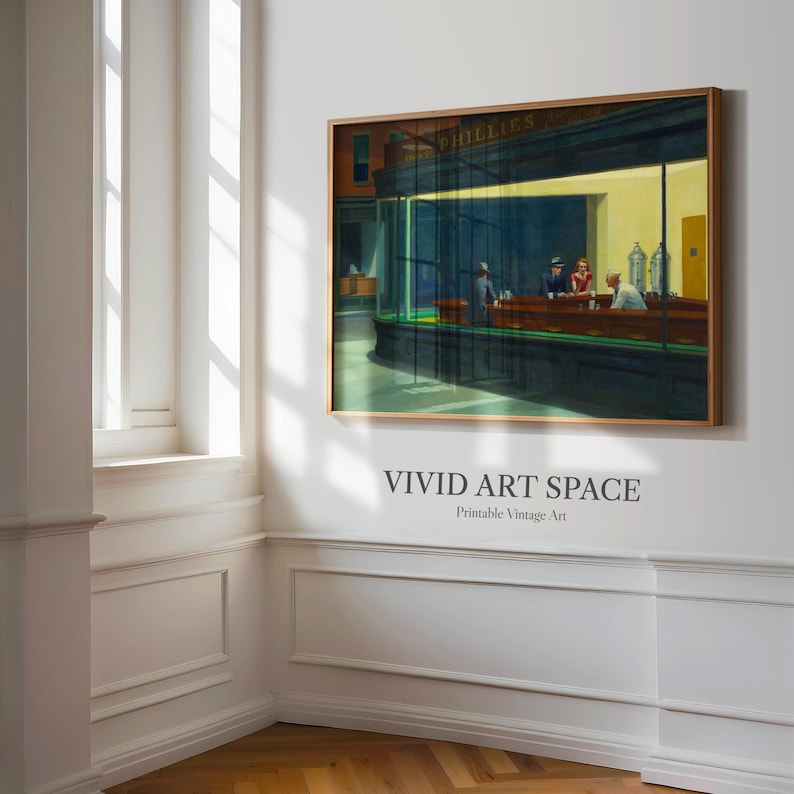 May include: A framed print of Edward Hopper's "Nighthawks" painting. The artwork depicts a diner scene with figures at the counter, bathed in artificial light. The print is labeled "VIVID ART SPACE Printable Vintage Art."