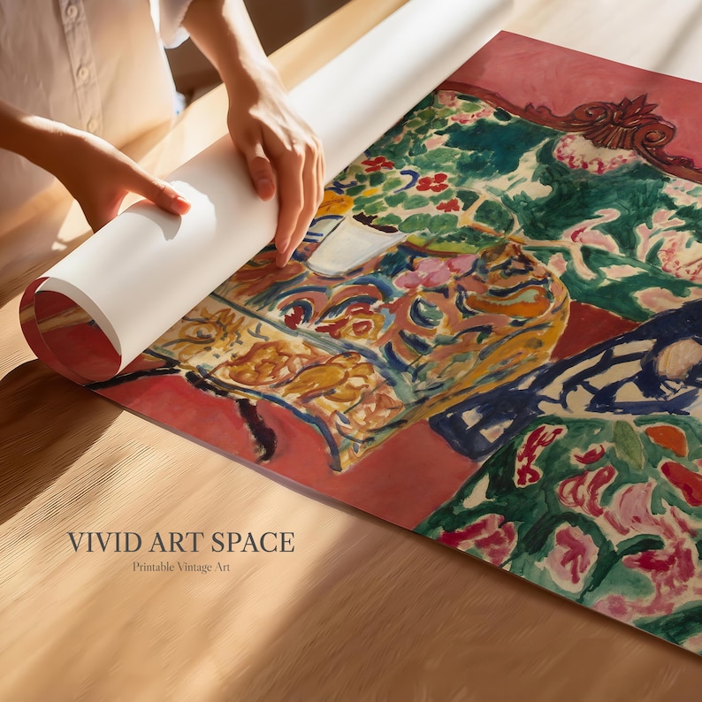 May include: A person unrolling a large print of a colourful painting with floral and abstract patterns. The artwork features shades of red, green, yellow, and blue. The text "VIVID ART SPACE" and "Printable Vintage Art" are visible.