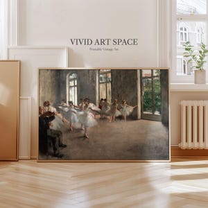 May include: A framed vintage print of a ballet rehearsal scene. The artwork depicts ballerinas in white tutus and a violinist in a dimly lit room. The text "VIVID ART SPACE Printable Vintage Art" is at the top.