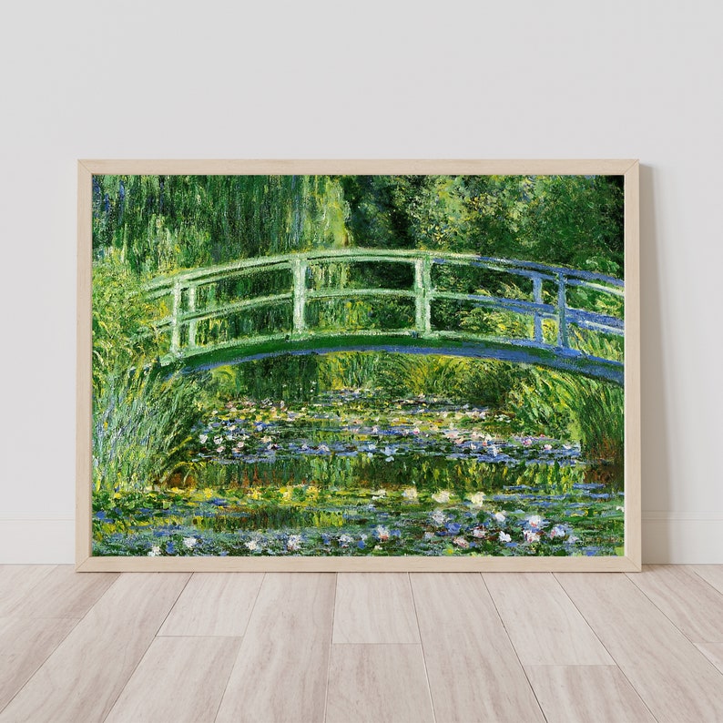 May include: A painting of a green bridge over a pond with water lilies. The bridge is made of wood and has a railing. The pond is surrounded by green trees and bushes. The water is a light blue color and there are many water lilies floating on the surface.