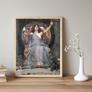 Puede incluir: Una pintura de una mujer con un vestido blanco fluido, sosteniendo una copa y una espada, sentada en un trono con un marco dorado. La mujer est&aacute; rodeada de un marco circular con un fondo oscuro.