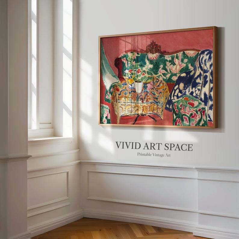 May include: A framed print of a vibrant interior scene. The artwork depicts a sofa and table with floral patterns, set against a red backdrop. The text "VIVID ART SPACE Printable Vintage Art" is below the frame.