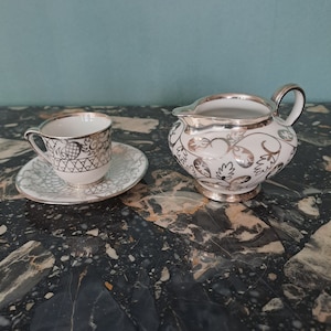 Art deco solitary coffee service France Limoges porcelain and solid silver decor