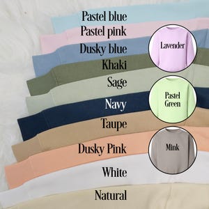 May include: A variety of colors of sweatshirts, including pastel blue, pastel pink, dusky blue, lavender, khaki, sage, navy, taupe, dusky pink, mink, white, and natural.