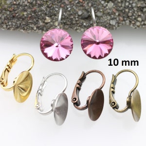 May include: A pair of pink crystal earrings with a 10 mm diameter. The earrings are shown with three different styles of earring findings: gold, silver, and bronze.