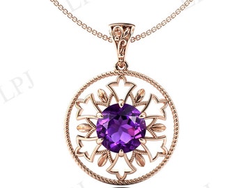 May include: Rose gold pendant necklace featuring a large, round, deep purple amethyst gemstone. The gemstone is set within an openwork, circular frame with an ornate floral design. The pendant hangs from a delicate chain.