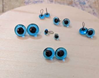 1 pair of blue glass eyes 4 to 9 mm with loop. Eyes for doll, teddy bears, knitted toy, amigurumi.