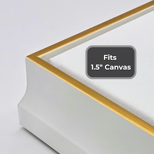 May include: White picture frame with a gold-colored inner edge. The frame is designed to fit a 1.5-inch canvas. The text "Fits 1.5" Canvas" is displayed on a gray background.