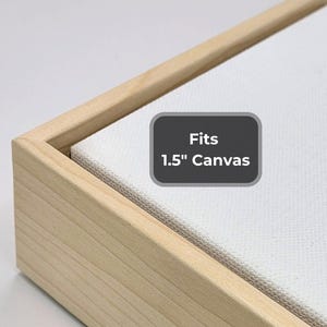 May include: A wooden frame with a light finish, designed to hold a 1.5-inch canvas. The frame's corner is visible, showcasing the joinery. The canvas is white and textured. A label indicates the frame's compatibility.