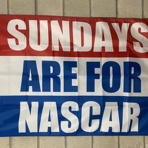 May include: A red, white, and blue flag with the text "Sundays Are For NASCAR" in white letters.