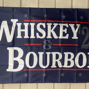 May include: A dark blue flag with white text that reads "Whiskey '24 & Bourbon". The flag has red stripes and white stars.
