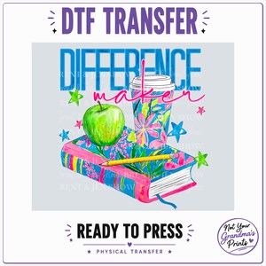 May include: A DTF transfer design featuring a book, a green apple, a yellow pencil, and a floral coffee cup. The text reads "DIFFERENCE maker" in blue and pink. The design includes small colorful stars and the text "DTF TRANSFER READY TO PRESS".