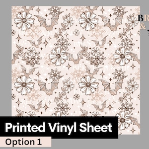 May include: A printed vinyl sheet featuring a repeating pattern of bats, flowers, snowflakes, and stars in shades of brown and white on a light pink background. The text "The Brent & Jen Show" is in the top right corner.