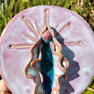 May include: A set of three ceramic mugs with a speckled, matte finish. The mugs are in shades of cream, light gray, and dark gray. Each mug has a simple, minimalist design, perfect for coffee or tea.