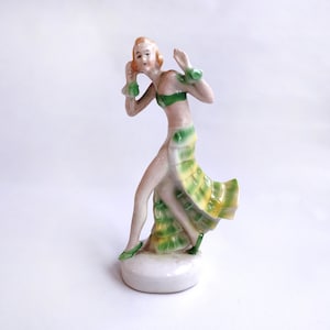 Glistening Art deco Porcelain Dancing Lady Figurine Girl Dancer Lustrous Green Yellow Flowing Flapper Dress Antique Collectible Germany 1930
