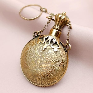 Sweet Victorian French Chatelaine Perfume Bottle Egyptian Hieroglyphs Motif Pendant Polished Gold Tone Brass Engraved Vinaigrette 19th c.