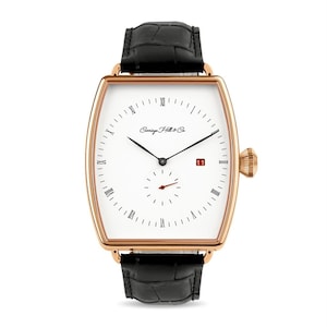 May include: A rose gold watch with a white face and black leather band. The watch has Roman numeral hour markers and a date window at the 3 o'clock position. The watch face also features the text "Carriage Hill & Co."