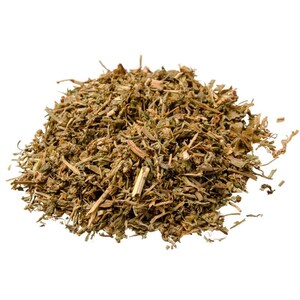 May include: A pile of dried, brown, and green herbs. The herbs are loose and appear to be chopped or shredded.