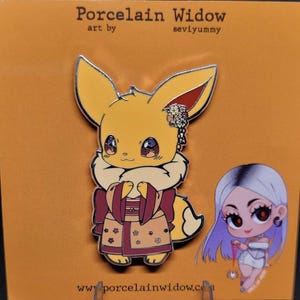 May include: A yellow and white enamel pin featuring a cartoon Eevee character wearing a kimono. The pin has a silver border and the text "Porcelain Widow" and "seviyummy" are printed on the top. A small illustration of a woman is on the right.