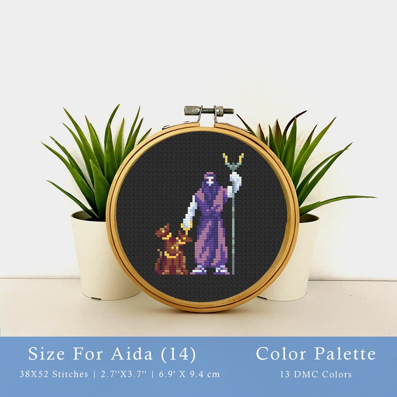 May include: Cross stitch pattern of a purple robed figure holding a trident and a small brown creature. The pattern is in a wooden embroidery hoop, with a size of 2.7 inches by 3.7 inches. The pattern uses 13 DMC colors.