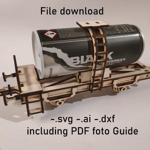 May include: A wooden model of a train car carrying a black spray paint can. The can is secured with a wooden ladder and frame. The text "BLACK FORMULA" is visible on the can. The image also includes the text "File download" and file type information.