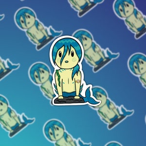May include: A sticker featuring a cartoon illustration of a blue-haired mermaid with a green sea serpent wrapped around its arm. The mermaid is sitting on a rock with its tail curled behind it. The sticker has a white border.