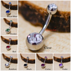 May include: A selection of belly button rings featuring various coloured gems. The gems are clear, red, green, blue, black, rainbow, pink and purple. The rings are made from surgical steel.