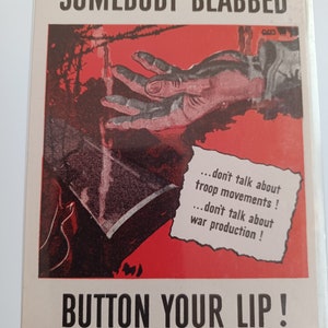 May include: A red and white World War II era propaganda poster with a hand reaching out from the top of the image. The poster reads "Somebody blabbed... don't talk about troop movements! ...don't talk about war production! Button your lip!" Issued by the Graphics Division, Office of War Information, Washington, D.C. S-2. U.S. Government Printing Office: 1942-0-471299.