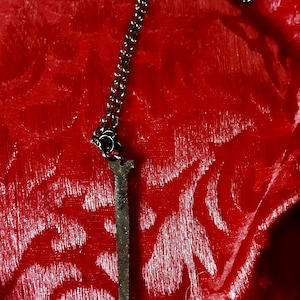 Coffin nail pendant  on a black steel chain