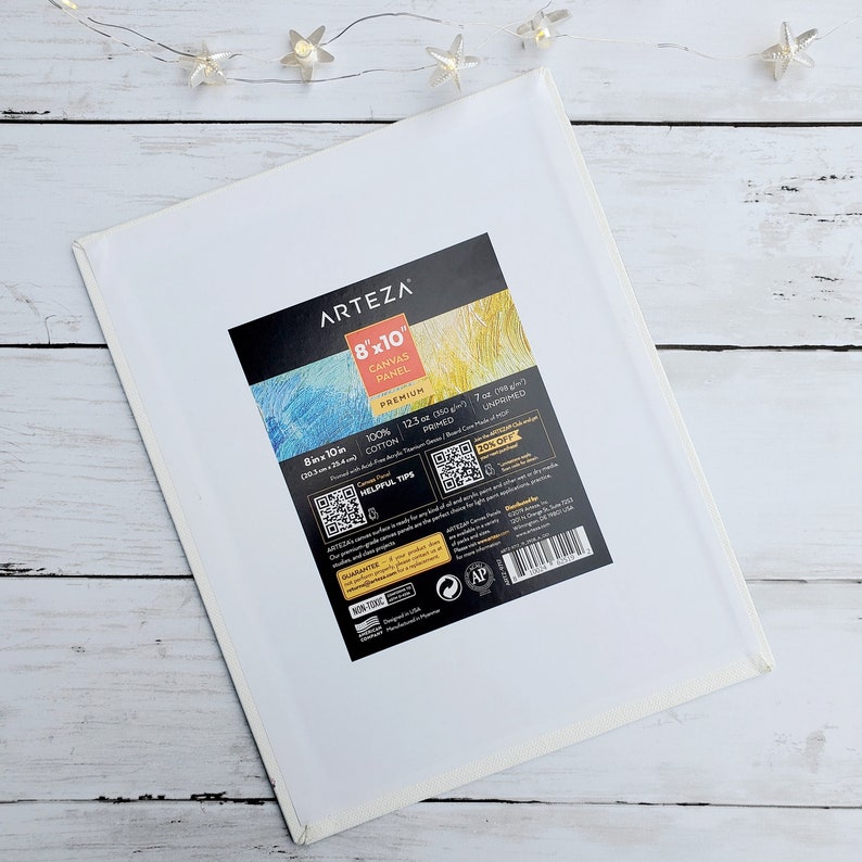 May include: A white 8x10 inch canvas panel from Arteza. The panel is 100% cotton and is primed and unprimed. It is 12.3 oz (350 g) and is made in the USA.