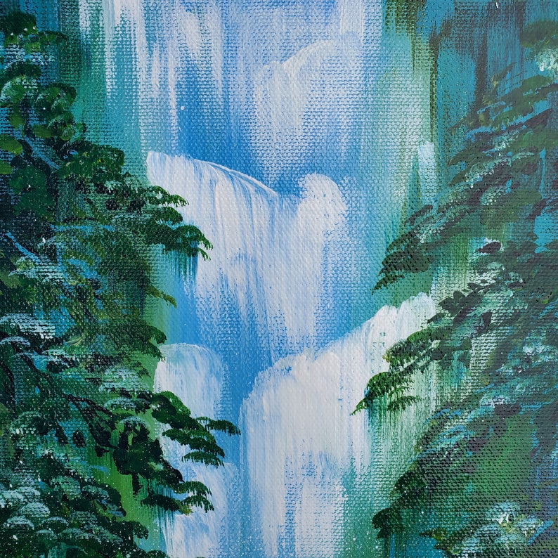 May include: A painting of a waterfall with green trees on either side. The waterfall is painted in shades of blue and white, and the trees are painted in shades of green.