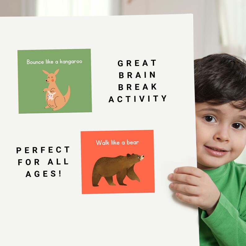 May include: A white poster with the text "Bounce like a kangaroo", "Walk like a bear", "GREAT BRAIN BREAK ACTIVITY", and "PERFECT FOR ALL AGES!"  The poster has two illustrations, one of a kangaroo and one of a bear. A young boy is holding the poster in front of him.
