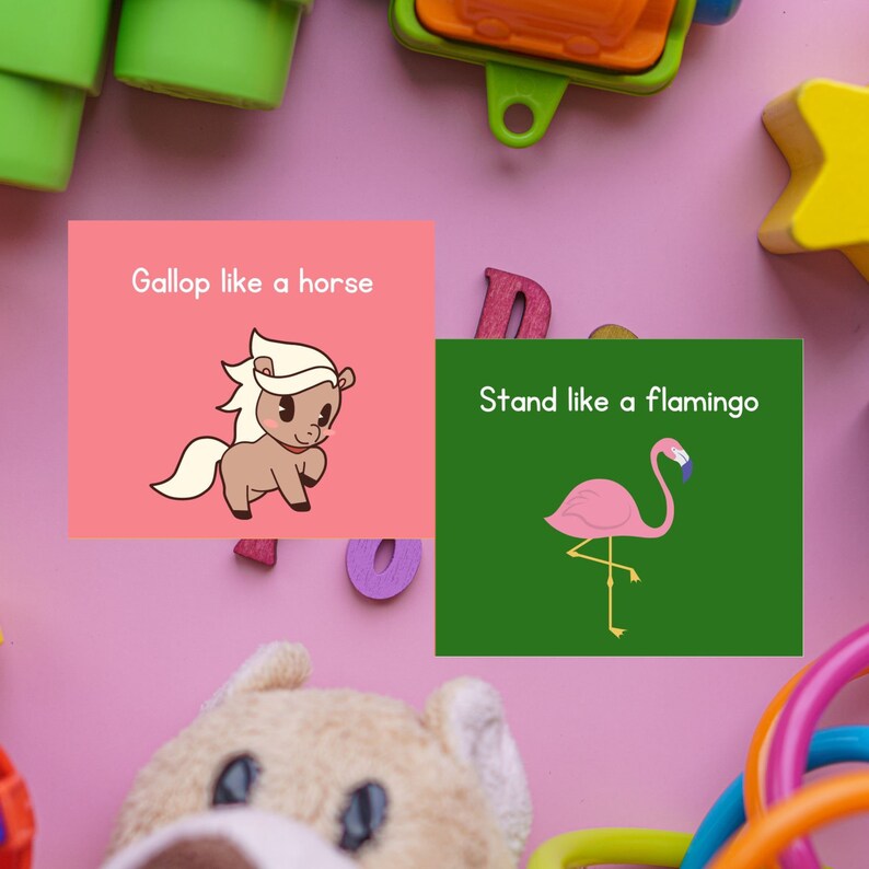 May include: Two pink and green cards with illustrations and text. The first card says "Gallop like a horse" and has a cartoon horse. The second card says "Stand like a flamingo" and has a cartoon flamingo.