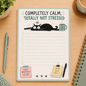 May include: A rectangular notepad featuring the text "COMPLETELY CALM, TOTALLY NOT STRESSED" at the top. It displays a black cat illustration, a green mug labelled "I'M FINE. SERIOUSLY", a lined checklist, and two sticky notes with the text "DEEP BREATHS? LOL NO." and "TO DO: EXIST. THAT'S IT."
