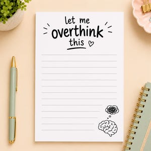 May include: A white rectangular notepad with horizontal lines, featuring the black printed text 'let me overthink this' at the top, a small heart icon, and a black line drawing of a brain with a thought bubble in the bottom right corner.