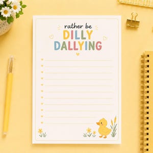 May include: A white rectangular notepad with horizontal lines and a checklist format. The top text reads rather be DILLY DALLYING in colourful letters. The bottom features a yellow duck illustration with small flowers and green reeds.