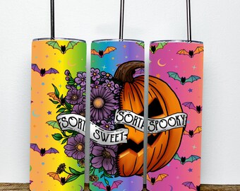 May include: Three stainless steel tumblers with a rainbow ombre background and a black bat pattern. The center tumbler features a pumpkin with a carved face and flowers, with the text "Sorta Sweet Sorta Spooky".