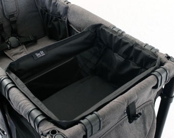 May include: A gray stroller with a black fabric storage basket and a black mesh pocket. The stroller has a black fabric seat with a black harness.